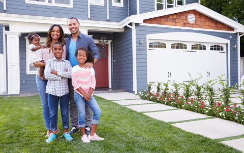 BIPOC homeownership Black family in front of a single family home